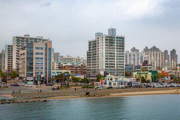 Fototapeta na wymiar City skyline buildings view of the coast of Pohang South Korea on a cloudy spring day