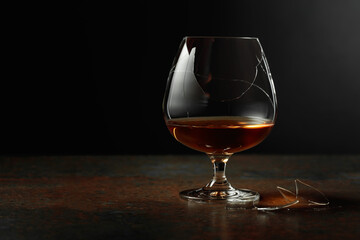 Brandy is in broken glass on a rusty background.