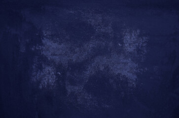 Grunge cement concrete wall background. Close up of deep  midnight blue mortar wall texture for design.
