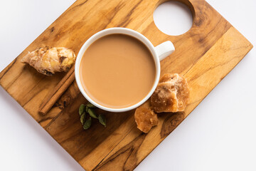 Jaggery tea or Gur ki chai with ingredients like gud, ginger or adrak, green cardamom and cinnamon