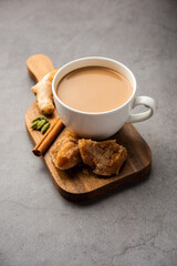 Jaggery tea or Gur ki chai with ingredients like gud, ginger or adrak, green cardamom and cinnamon