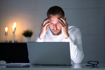 Stressed Depressed Man At Desk
