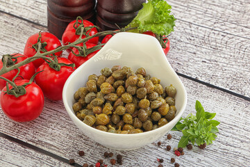 Marinated green capers in the bowl