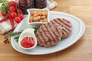 Grilled beef burger cutlet with sauce