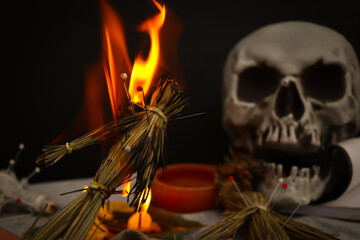 curse doll in hand and skull background