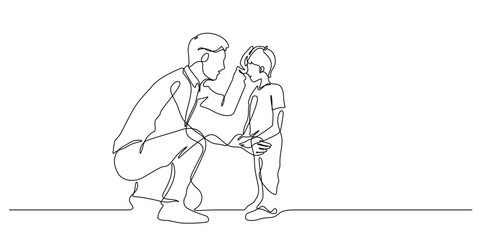 father kneeling and rub his son gently on head