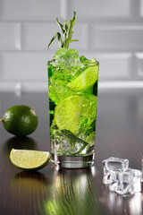 Green lemonade with tarragon, lime and mint. Selective focus.