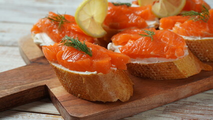 Open sandwiches with trout fillet ,wheat bread with butter and herbs