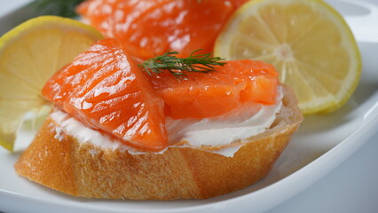 Open sandwiches with trout fillet ,wheat bread with butter and herbs
