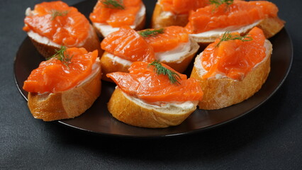 Open sandwiches with trout fillet ,wheat bread with butter and herbs