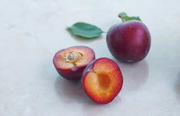 halved red plums