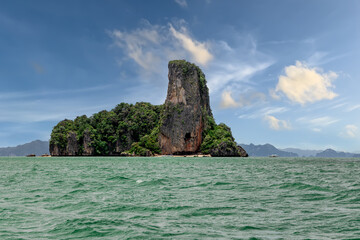 Fototapeta na wymiar Island Phuket Thailand. Lovely rock in the middle of the ocean surrounded by mountains