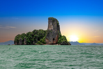 Naklejka premium Island Phuket Thailand. Lovely rock in the middle of the ocean surrounded by mountains