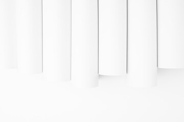 White abstract geometric background with soft light vertical smooth tubes or stripes as pattern,...