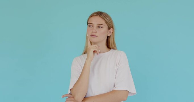 Inspired woman with long hair pointing finger up with genius idea