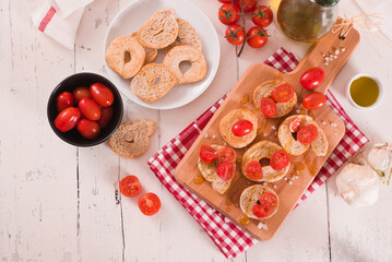 Friselle with cherry tomatoes and olive oil.