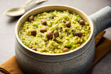 Palak khichdi is a one pot nutritious meal of mung lentils and rice with spinach, Indian food - obrazy, fototapety, plakaty