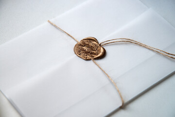 Fototapeta premium White envelope with a seal. Light background