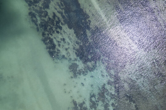 Sea surface aerial view, Bird eye view photo of seafoam waves, and water surface texture. Amazing view Top-down © panya99