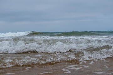 waves of the atlantic ocean on the beach of La Barrosa in Cadiz, Spain