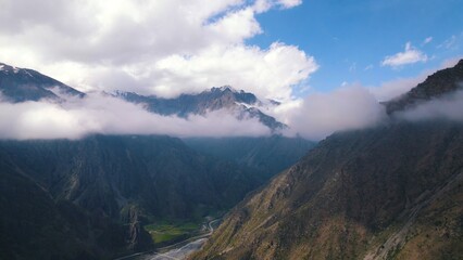 Fototapeta premium marvelous birds-eye view of Dariali gorge from the clouds, Kazbegi, Georgia. High quality photo