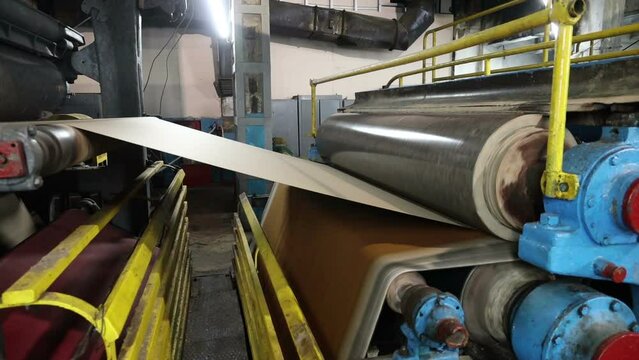 conveyor of a paper machine in the workshop of a paper mill
