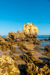 Fototapeta na wymiar Detail of the rocks at Praia dos Arrifes, Algarve beach, Albufeira. Portugal. tourism in summer