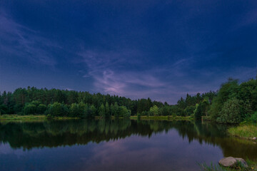 Small forest lake at night, Belarus