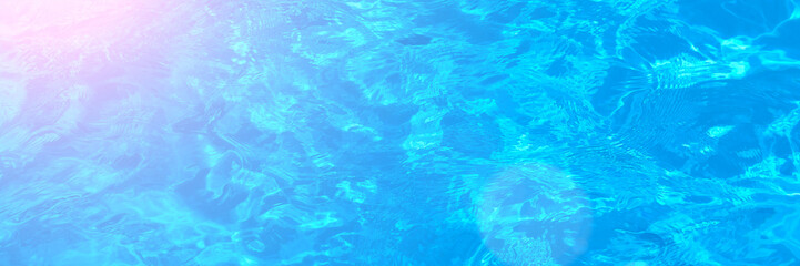 Water texture close up. Bright blue and pink gradient liquid or gel background. Transparent beauty skincare sample. Water clear transparent background. Long banner with copy space