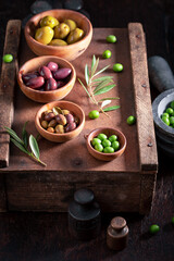 Obraz na płótnie Canvas Set of olives with extra virgin olive oil.