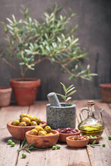 Various types of olives with extra virgin olive oil.