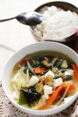 Korean food, dried fish and tofu with seaweed soy sprout soup