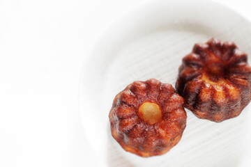 French confectionery, Canelé on dish for gourmet dessert
