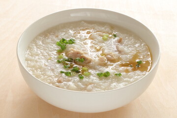 Chinese food, pork congee with sesame oil and spring onion