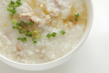 Chinese food, pork congee with sesame oil and spring onion
