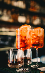 Aperol Spritz Cocktail in glass on bar counter 