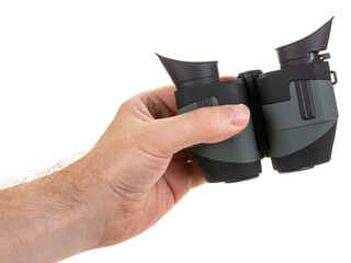 A man's hand holds a modern compact binoculars, bottom view. Isolated on white background.