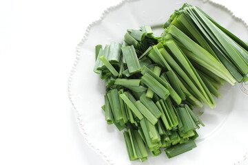 chopped leek on plate or prepared ingredient for Chinese vegetable cooking