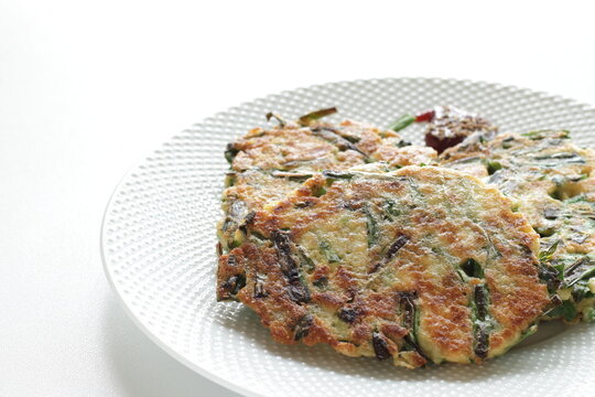 Korean food, leek and tofu Jeon Pancake on dish with copy space for nutrition cooking image
