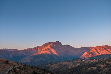 Morning sunlight on the 2389 metre high mountain peak of Monte Padro in the Balagne region of Corsica
