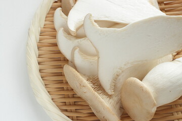 Japanese mushroom, sliced oyster mushroom on bamboo basket for cooking ingredient
