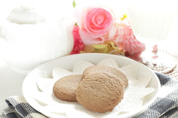 Homemade coffee cookies on lace paper with copy space