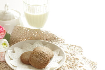 Homemade coffee cookies on lace paper with copy space