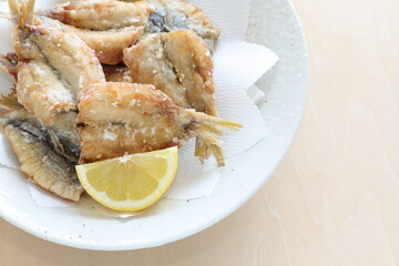 Japanese food, deep fried spotted sardine fish served with lemon