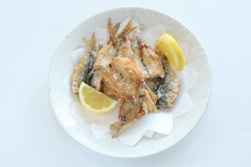 Japanese food, deep fried spotted sardine fish served with lemon