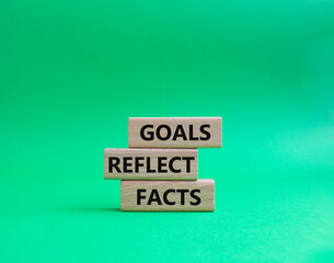 Goals reflect values symbol. Concept words Goals reflect values on wooden blocks. Beautiful green background. Business and Goals reflect values concept. Copy space
