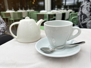 tea cup with teapot  in a restaurant