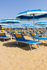 Traditional beach chair and umbrella. Rimini, Italy,