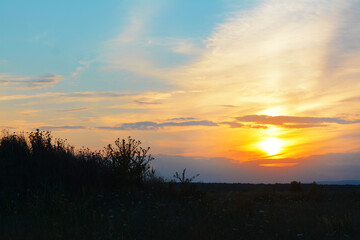 Fototapeta na wymiar Beautiful landscape with sky lit by sunset