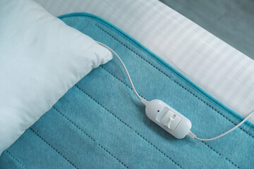 Bed with electric heating pad, top view